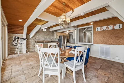 a spacious bedroom with a bed and a table