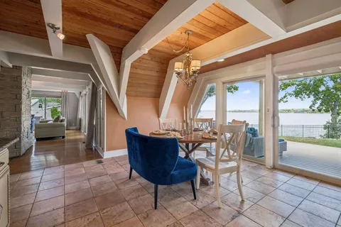 a bathroom with a granite countertop double vanity sink and a mirror