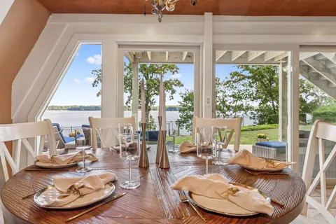 a view of entryway with wooden floor and stairs