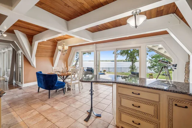 a bedroom with a bed and a chair