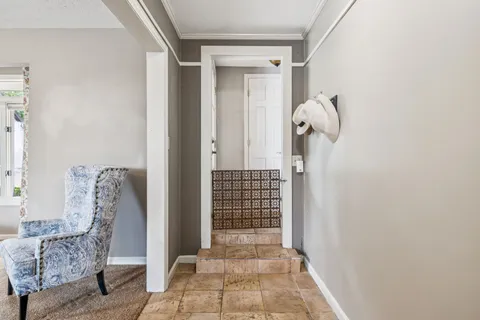 a view of a balcony with wooden floor and furniture