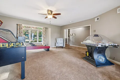 a view of a house with backyard porch and sitting area
