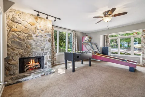 a view of a backyard with sitting area