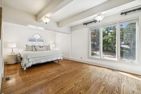 a view of backyard of house with green space