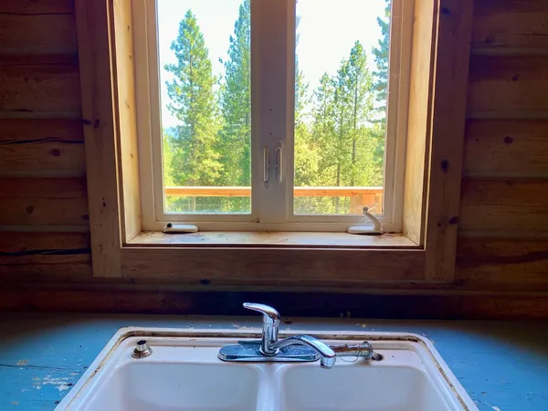 a balcony with wooden floor and furniture