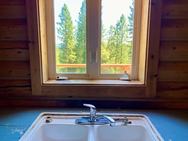 a balcony with wooden floor and furniture