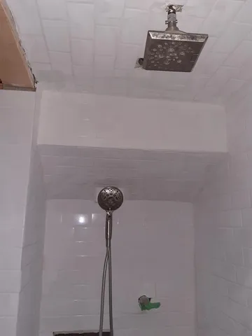 a view of balcony with wooden floor and fence