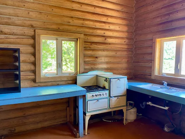 a view of a patio with table and chairs and potted plants