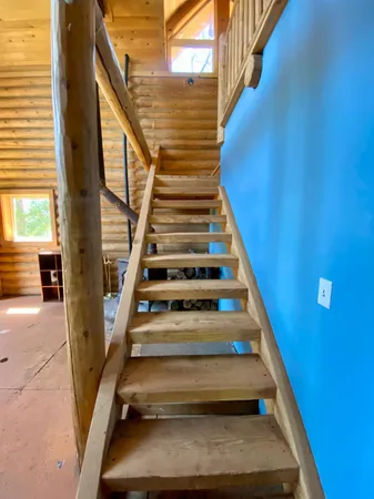 a view of a backyard of a house with a yard