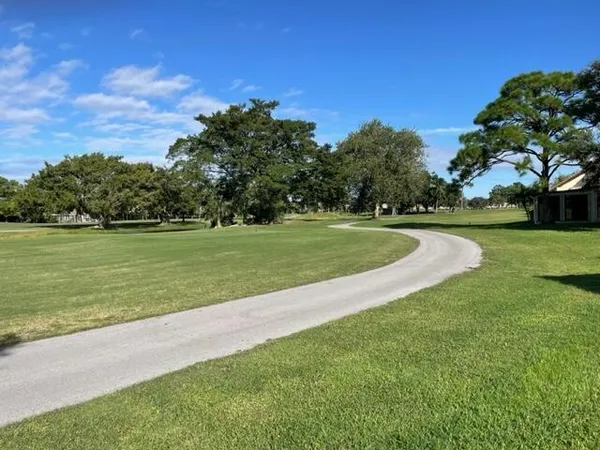 a view of a golf course with a lake