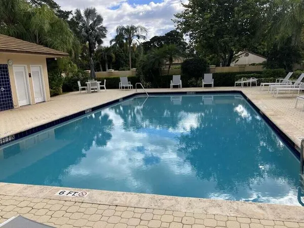 a view of a swimming pool with a patio