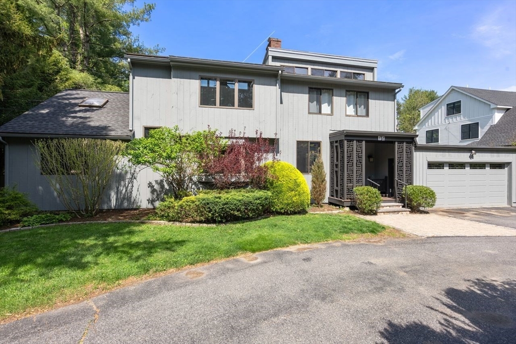 72 Brook Road Weston, MA 02493 - Photo 1 of 1 a white house with a small yard and a large parking space