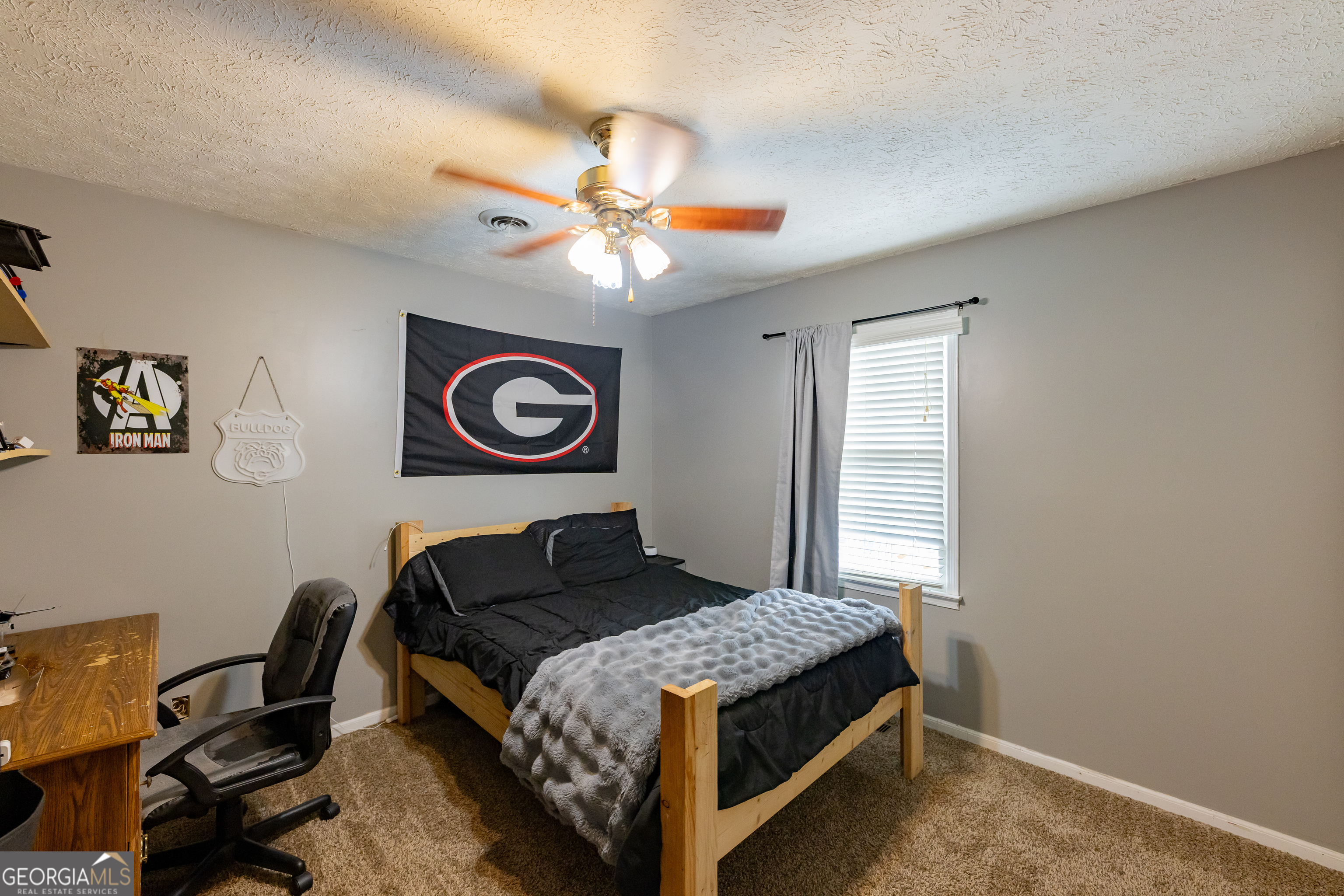 202 Daniel Road Thomaston, GA 30286 - Photo 19 of 112 a bedroom with a bed and a chandelier