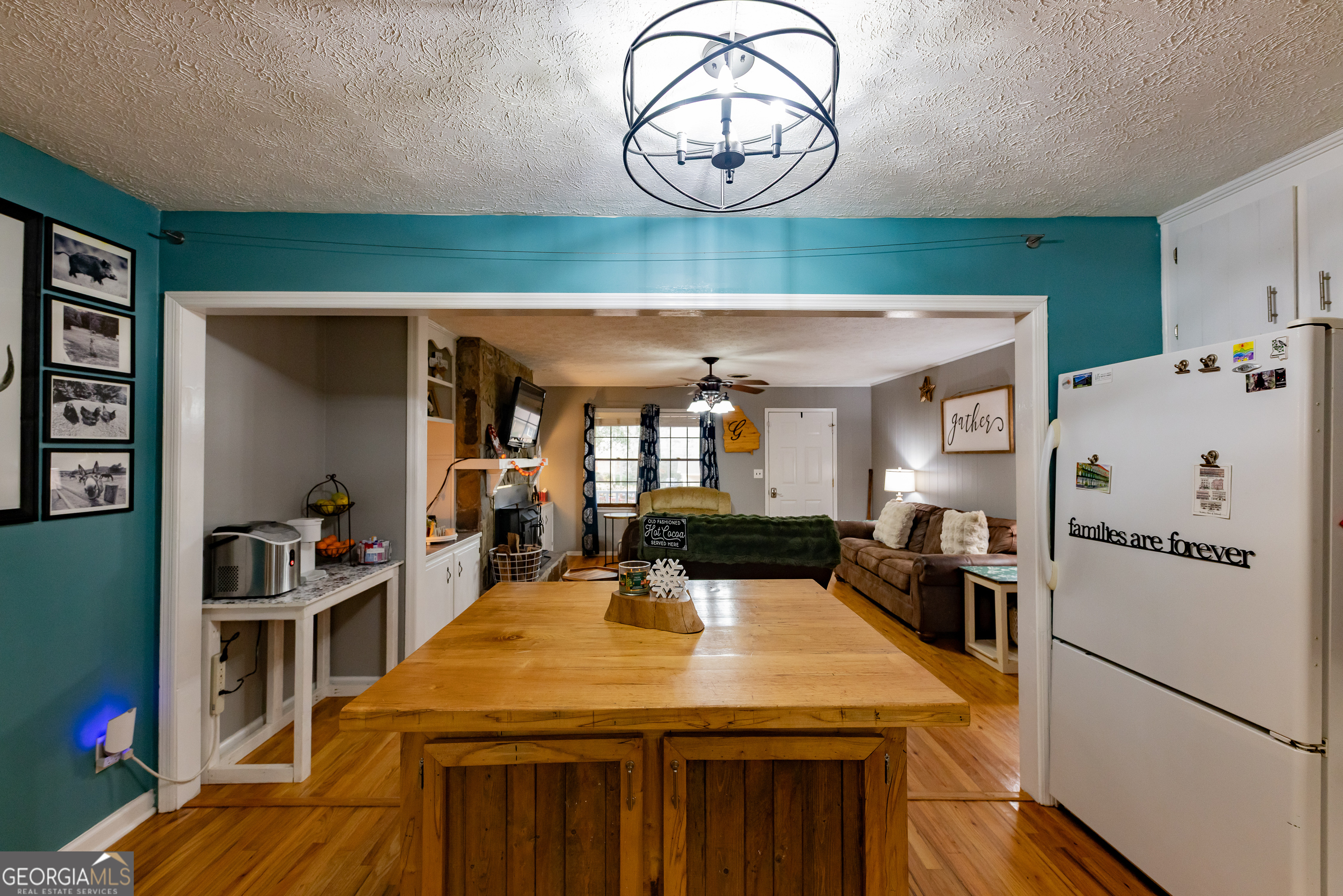202 Daniel Road Thomaston, GA 30286 - Photo 4 of 112 a kitchen with stainless steel appliances granite countertop a sink dishwasher and a refrigerator with wooden floor