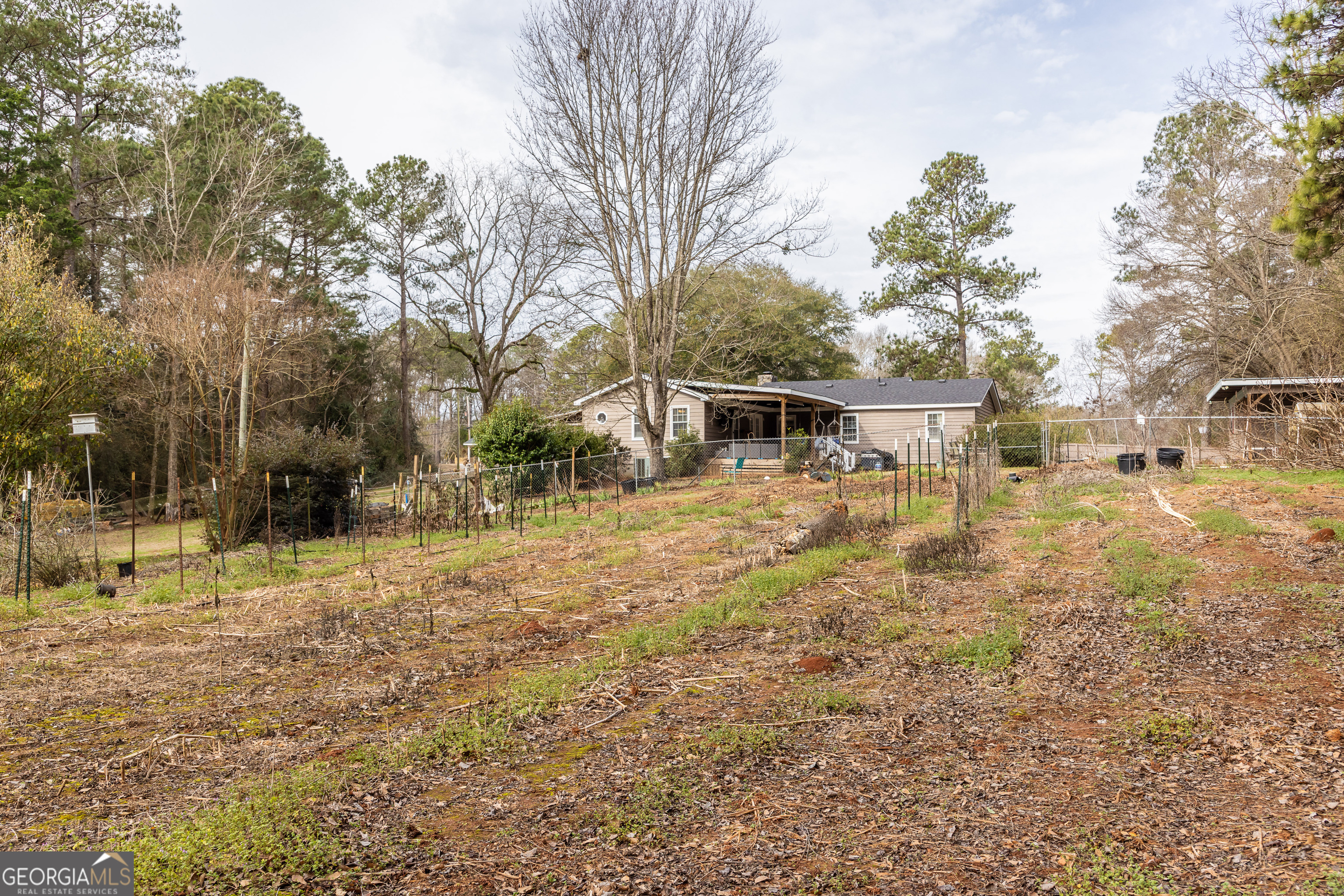 202 Daniel Road Thomaston, GA 30286 - Photo 47 of 112 a backyard of a house with table and chairs