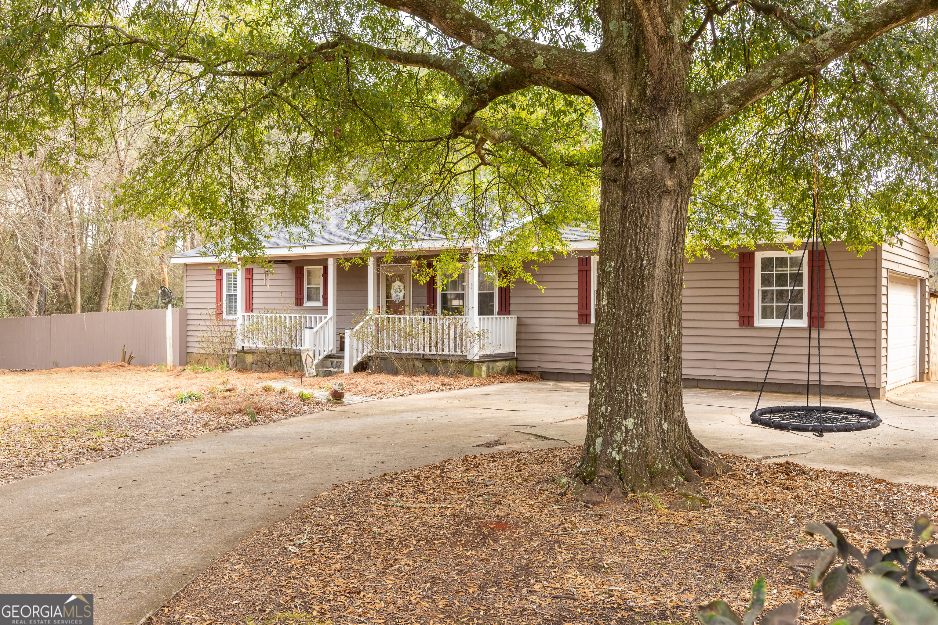 202 Daniel Road Thomaston, GA 30286 - Photo 56 of 112 a backyard of a house with table and chairs