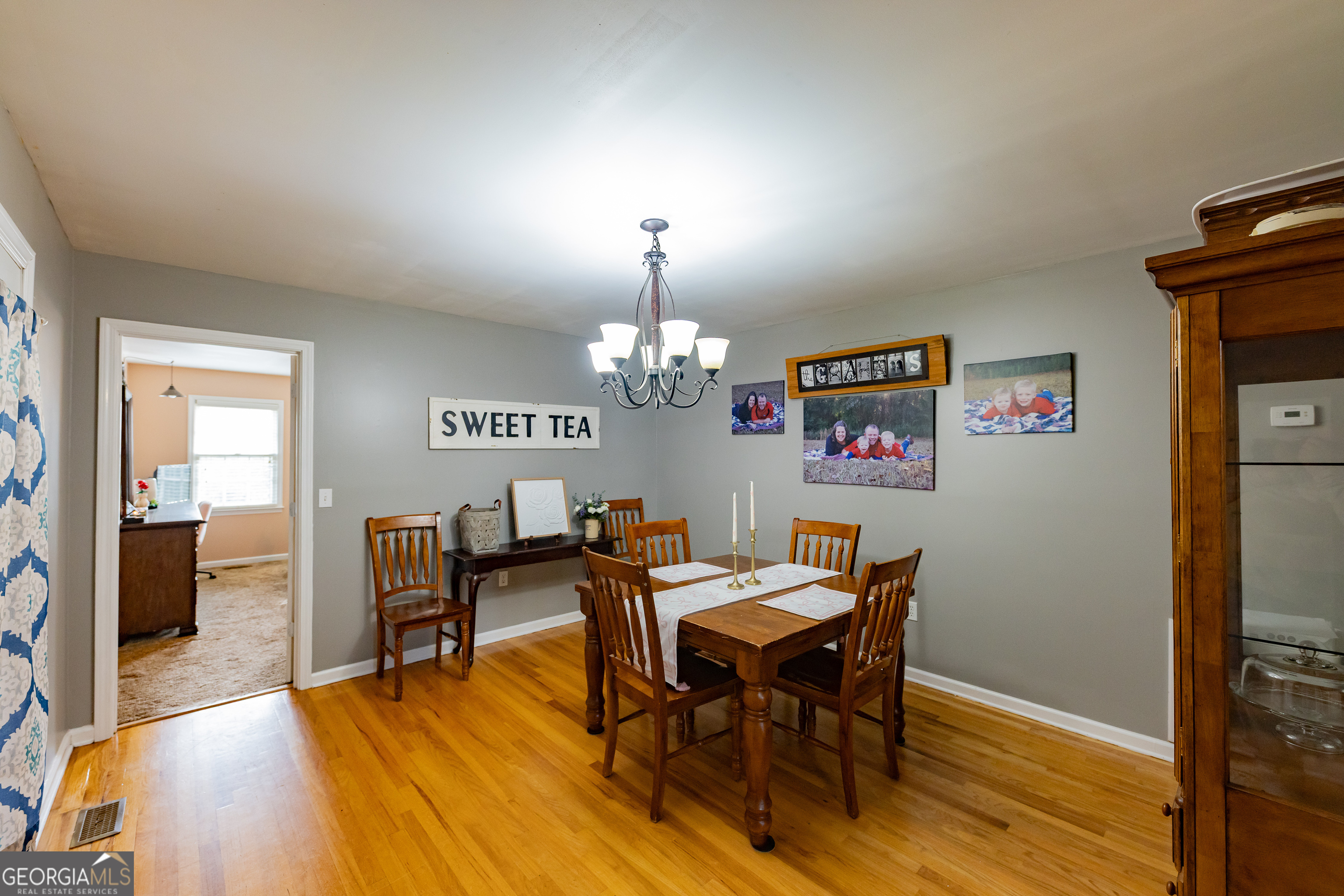 202 Daniel Road Thomaston, GA 30286 - Photo 8 of 112 a view of a dining room with furniture and wooden floor