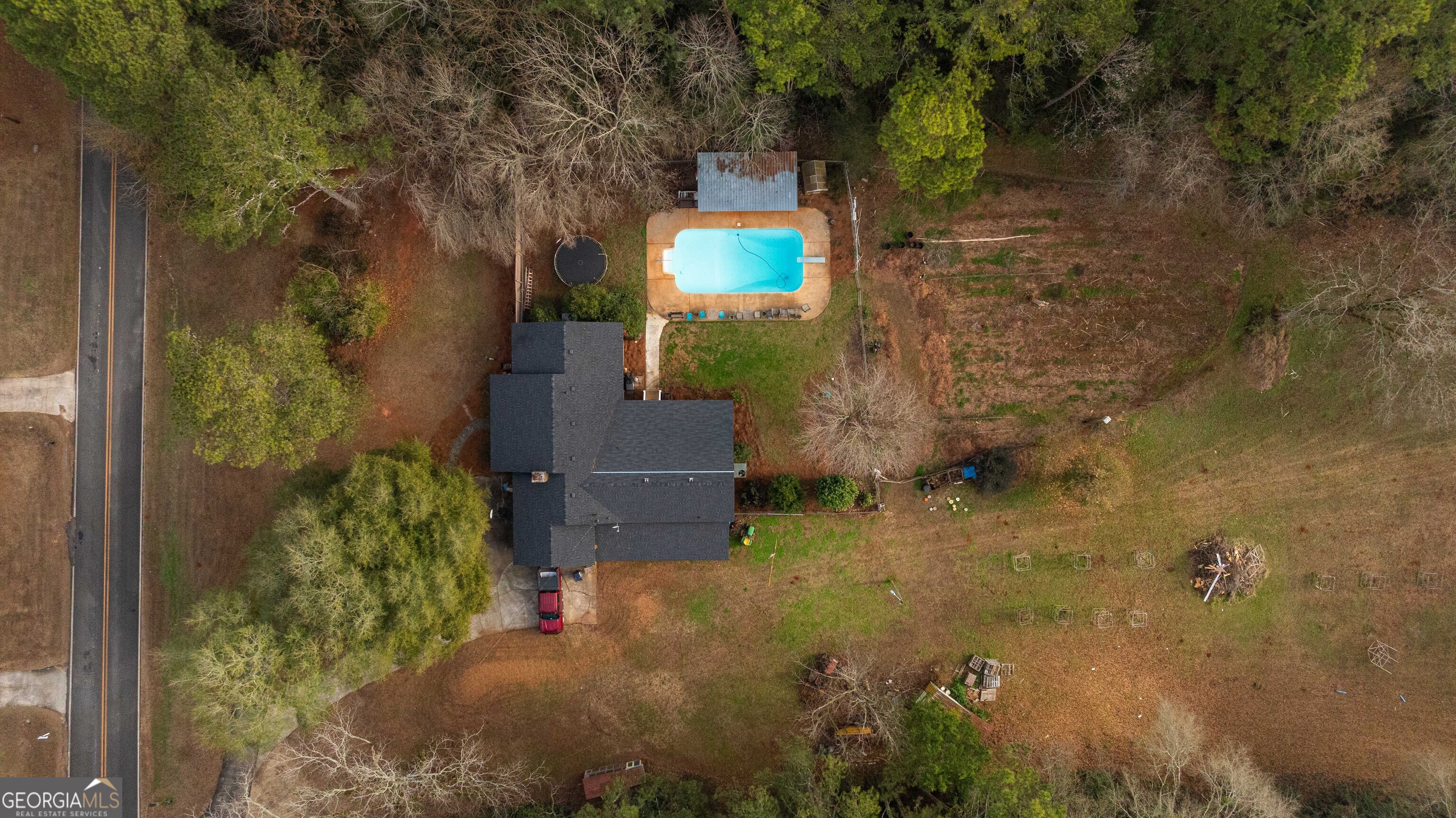 202 Daniel Road Thomaston, GA 30286 - Photo 88 of 112 a backyard of a house with a yard and outdoor seating