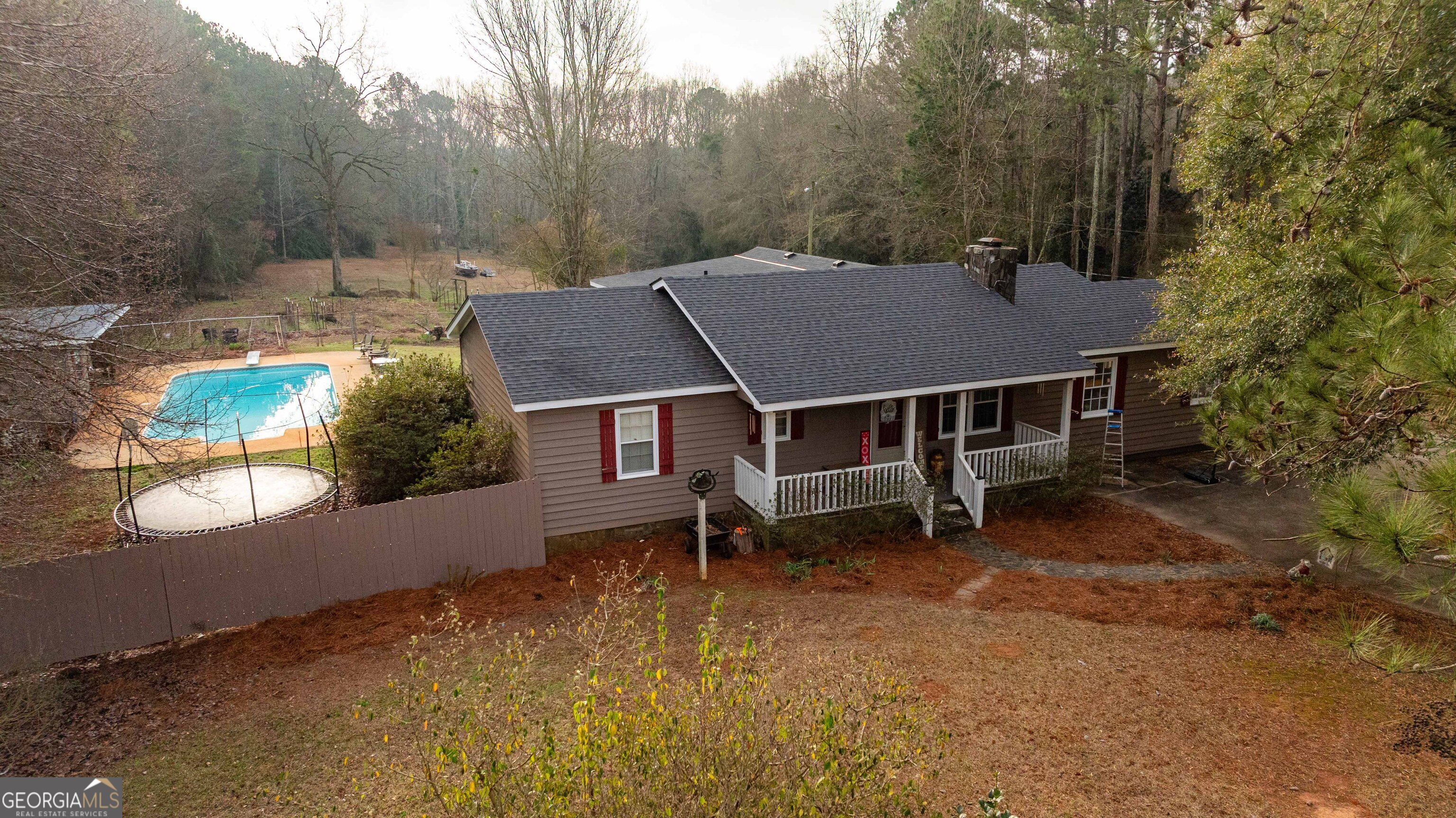 202 Daniel Road Thomaston, GA 30286 - Photo 97 of 112 an aerial view of a house with swimming pool and wooden fence