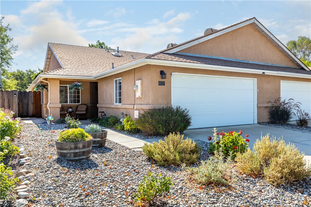 408 Turtle Creek Road Paso Robles, CA 93446 - Photo 1 of 35 a front view of a house with garden