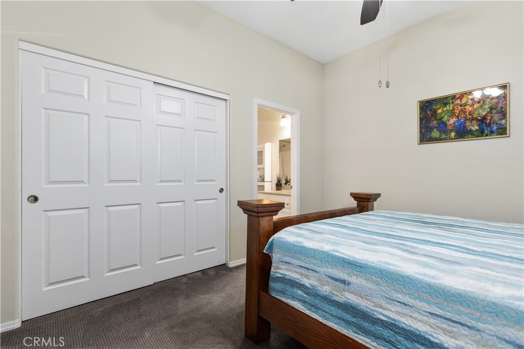 408 Turtle Creek Road Paso Robles, CA 93446 - Photo 18 of 35 a bedroom with a bed and a painting on the wall