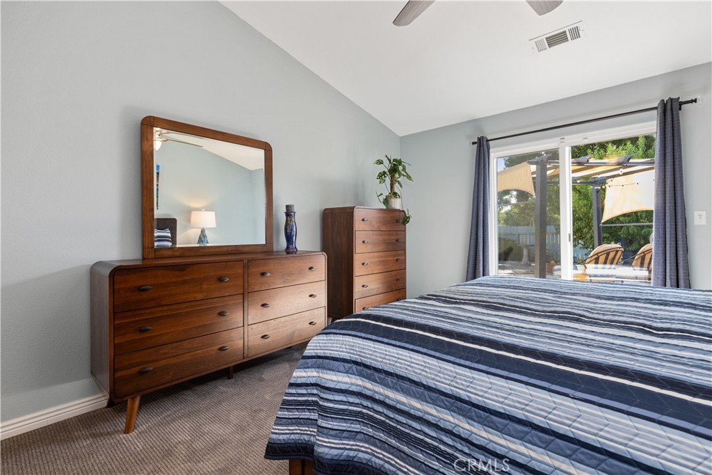 408 Turtle Creek Road Paso Robles, CA 93446 - Photo 22 of 35 a bedroom with a bed and a large window