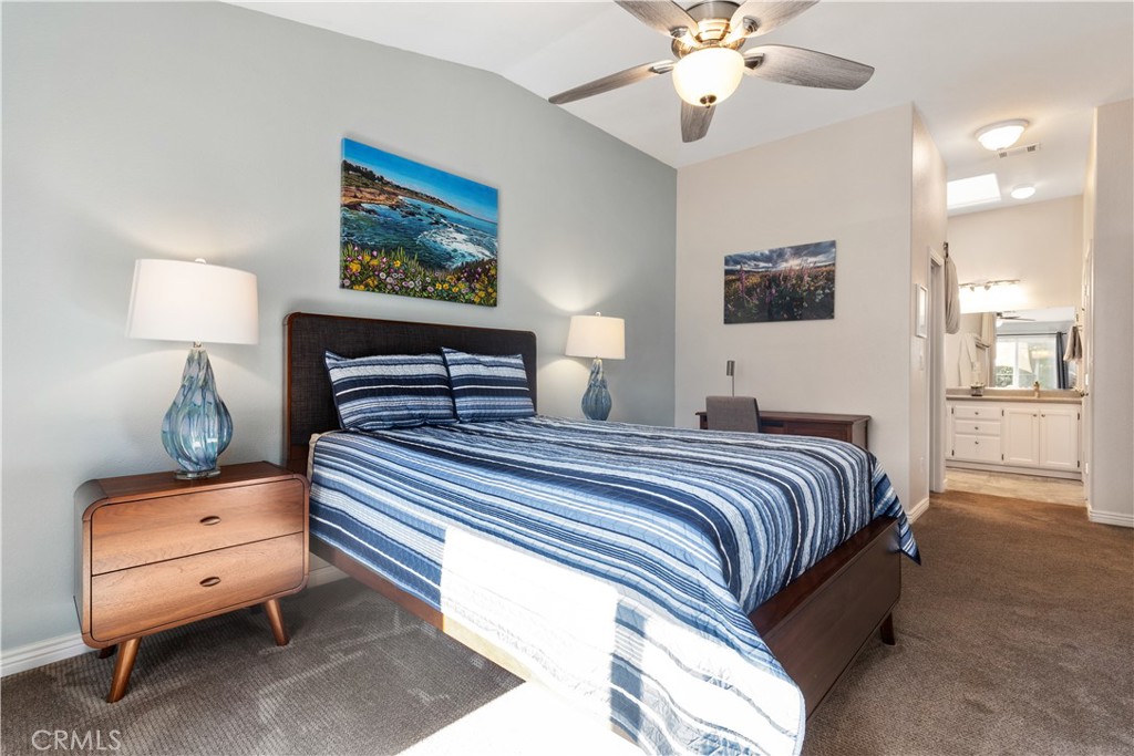 408 Turtle Creek Road Paso Robles, CA 93446 - Photo 23 of 35 a bedroom with a bed and a chandelier