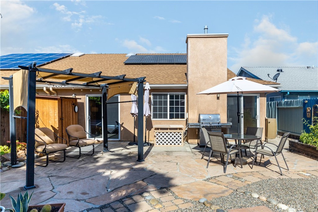 408 Turtle Creek Road Paso Robles, CA 93446 - Photo 28 of 35 a patio with a table and chairs under an umbrella