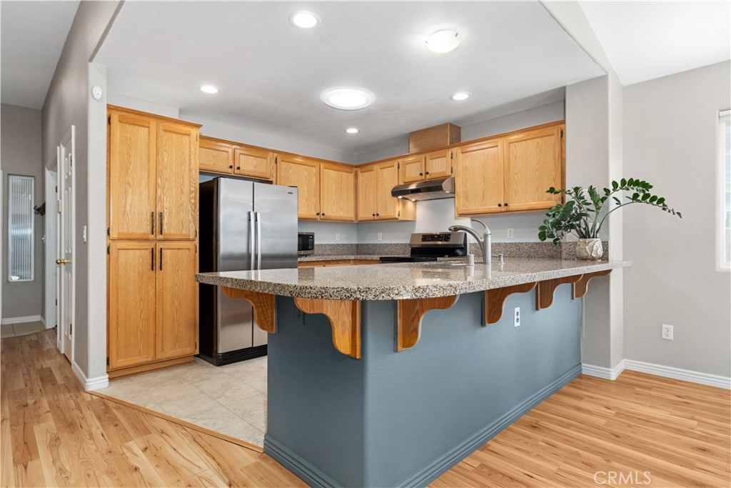 408 Turtle Creek Road Paso Robles, CA 93446 - Photo 3 of 35 a kitchen with stainless steel appliances granite countertop a refrigerator a stove a sink and a microwave