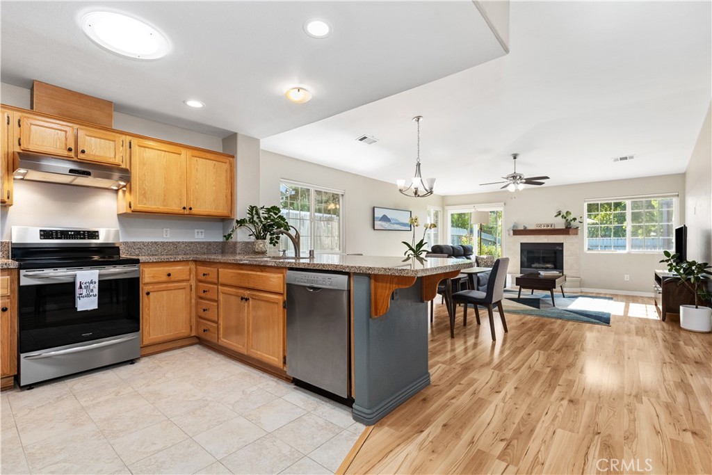 408 Turtle Creek Road Paso Robles, CA 93446 - Photo 4 of 35 a kitchen with stainless steel appliances granite countertop a stove and cabinets