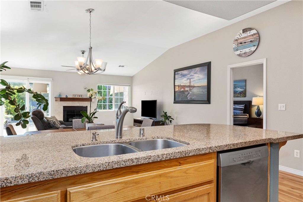 408 Turtle Creek Road Paso Robles, CA 93446 - Photo 5 of 35 a kitchen with granite countertop a sink and a fireplace
