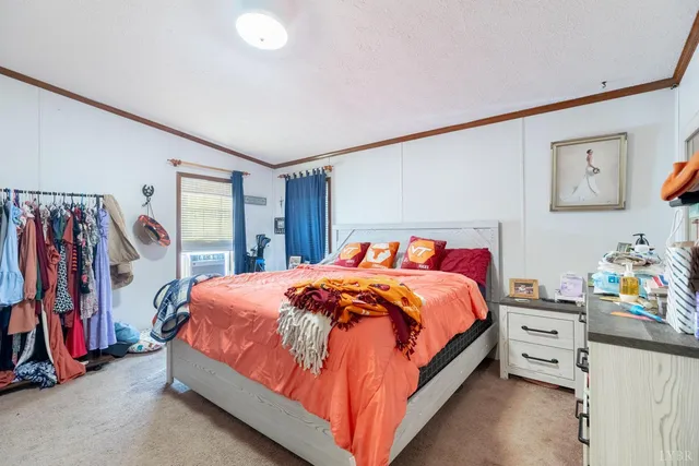 a bedroom with bed and a closet