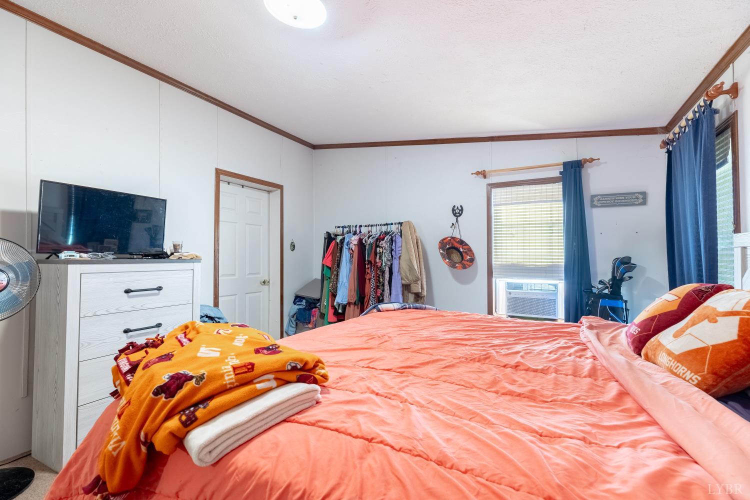 2307 Everett Road Forest, VA 24551 - Photo 15 of 31 a bedroom with a bed and a flat screen tv