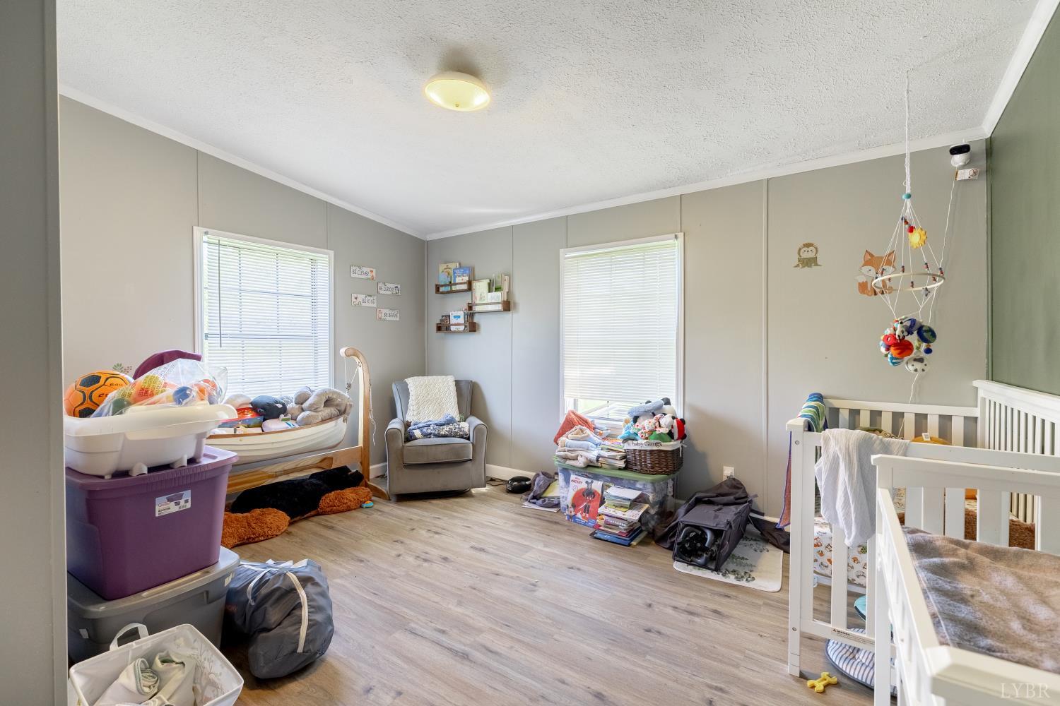 2307 Everett Road Forest, VA 24551 - Photo 19 of 31 a playing room with toys and a wooden floor