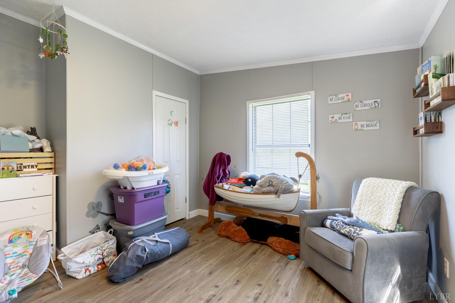 2307 Everett Road Forest, VA 24551 - Photo 20 of 31 a living room with furniture and a wooden floor