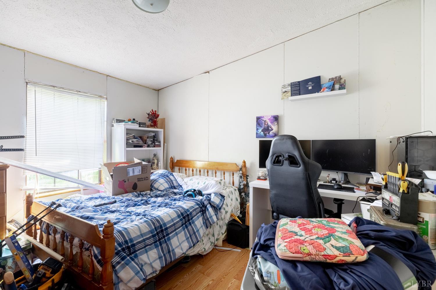 2307 Everett Road Forest, VA 24551 - Photo 22 of 31 a bedroom with a bed and wooden floor