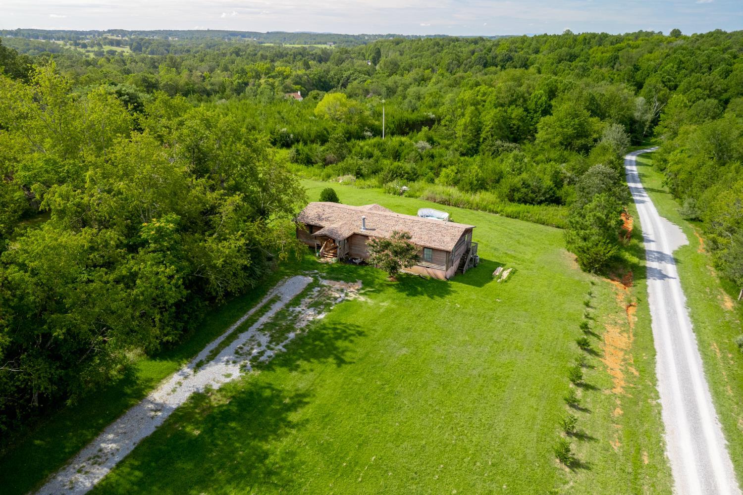 2307 Everett Road Forest, VA 24551 - Photo 25 of 31 a view of a backyard with plants and a garden