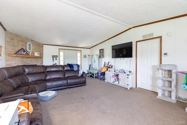 a view of a livingroom with workspace and a couch