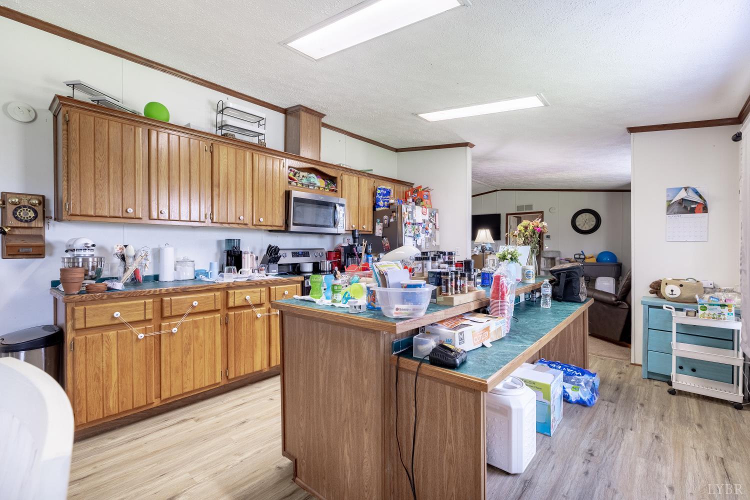 2307 Everett Road Forest, VA 24551 - Photo 7 of 31 a kitchen filled with stainless steel appliances granite countertop a sink dishwasher stove and cabinets with wooden floor