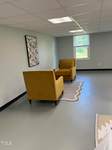 a room with furniture and window