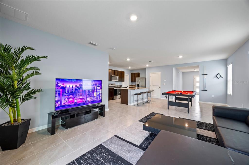 1680 Hazy Sea Drive Plant City, FL 33565 - Photo 13 of 49 a living room with furniture and a flat screen tv