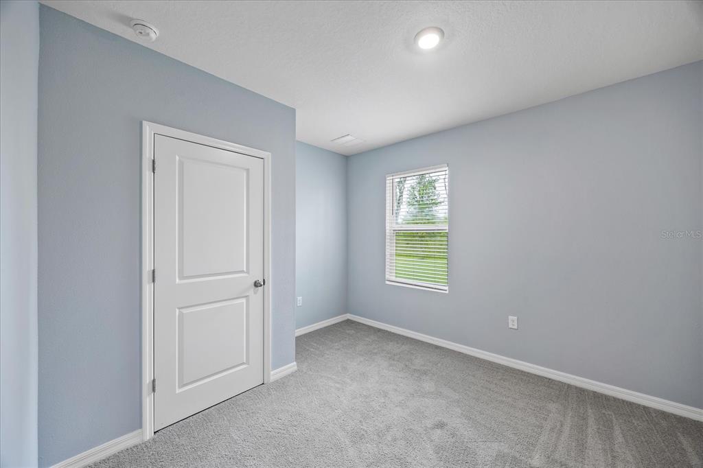 1680 Hazy Sea Drive Plant City, FL 33565 - Photo 19 of 49 an empty room with windows and closet