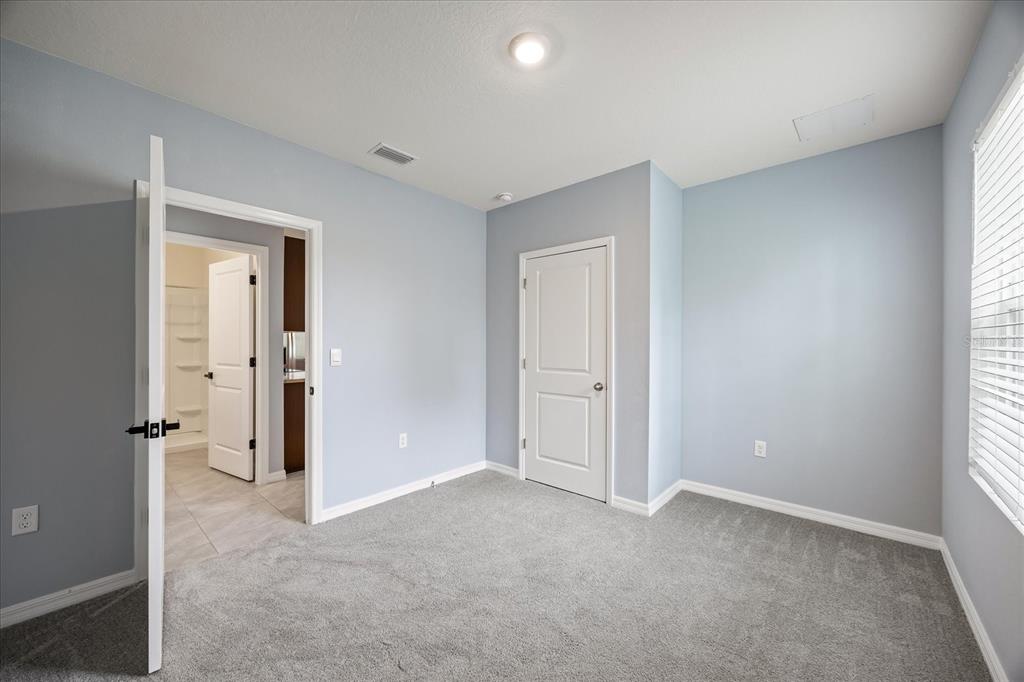 1680 Hazy Sea Drive Plant City, FL 33565 - Photo 20 of 49 an empty room with windows and closet