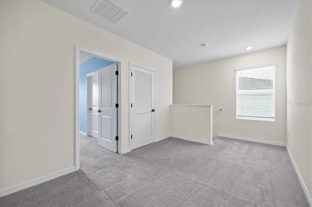 a room with a bed and a window