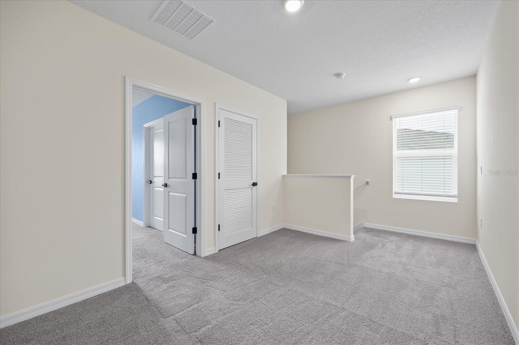 1680 Hazy Sea Drive Plant City, FL 33565 - Photo 24 of 49 an empty room with windows and closet