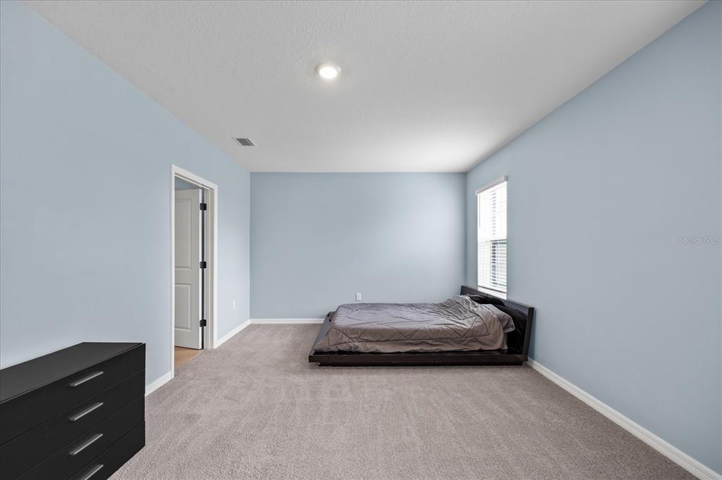 1680 Hazy Sea Drive Plant City, FL 33565 - Photo 27 of 49 a room with a bed and a window