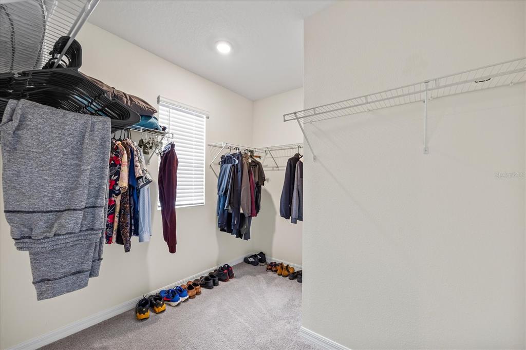 1680 Hazy Sea Drive Plant City, FL 33565 - Photo 28 of 49 a view of walk in closet with clothes and shoes