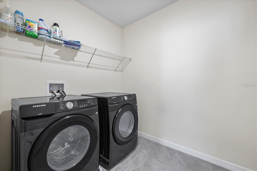 1680 Hazy Sea Drive Plant City, FL 33565 - Photo 31 of 49 a utility room with dryer and washer