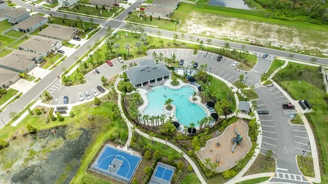 an aerial view of a house with garden space and street view