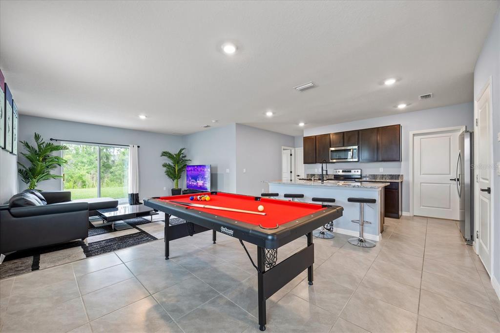 1680 Hazy Sea Drive Plant City, FL 33565 - Photo 8 of 49 a room with pool table furniture and windows